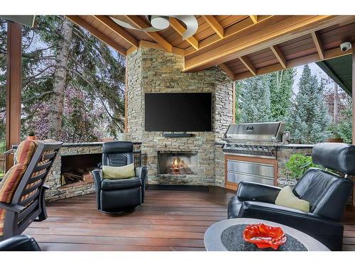 128 Lake Mead Green Se, Calgary, AB - Outdoor With Fireplace With Deck Patio Veranda With Exterior