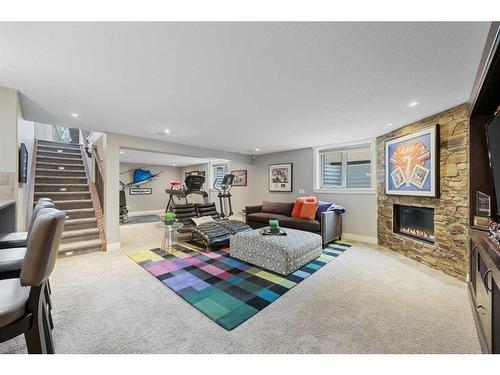 128 Lake Mead Green Se, Calgary, AB - Indoor Photo Showing Living Room With Fireplace