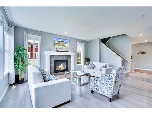 100 Redstone Parade Ne, Calgary, AB - Indoor Photo Showing Living Room With Fireplace