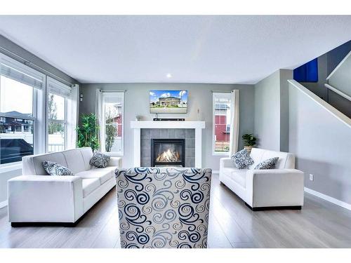 100 Redstone Parade Ne, Calgary, AB - Indoor Photo Showing Living Room With Fireplace