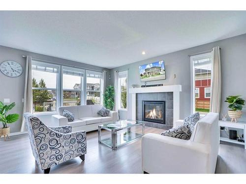 100 Redstone Parade Ne, Calgary, AB - Indoor Photo Showing Living Room With Fireplace