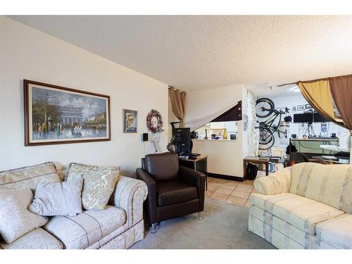 104-525 56 Avenue Sw, Calgary, AB - Indoor Photo Showing Living Room