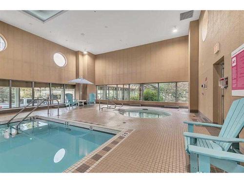 907-55 Spruce Place Sw, Calgary, AB - Indoor Photo Showing Other Room With In Ground Pool