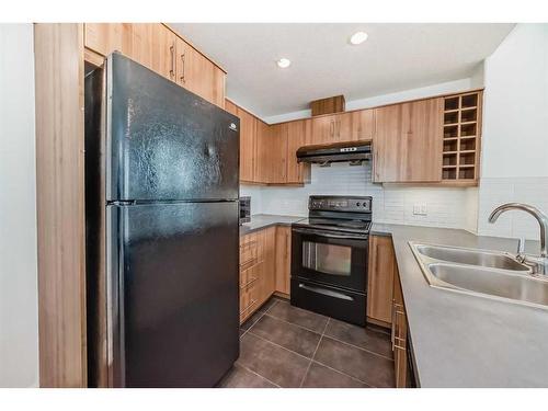 907-55 Spruce Place Sw, Calgary, AB - Indoor Photo Showing Kitchen With Double Sink