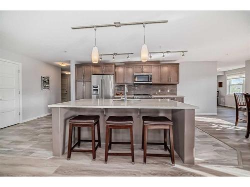 1310-10 Market Boulevard Se, Airdrie, AB - Indoor Photo Showing Kitchen With Stainless Steel Kitchen With Upgraded Kitchen