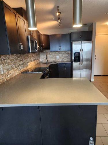 2305-1320 1 Street Se, Calgary, AB - Indoor Photo Showing Kitchen With Double Sink