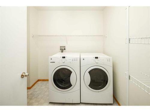 8 Arbour Ridge Place Nw, Calgary, AB - Indoor Photo Showing Laundry Room