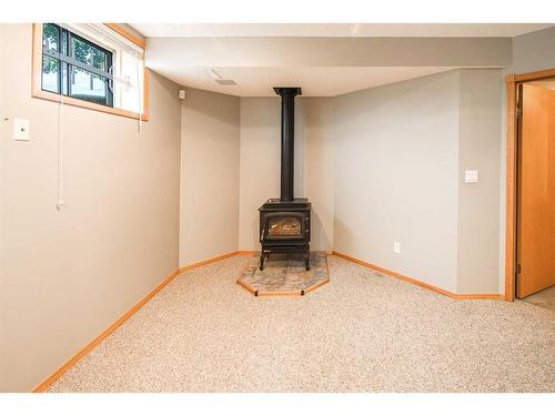 8 Arbour Ridge Place Nw, Calgary, AB - Indoor With Fireplace