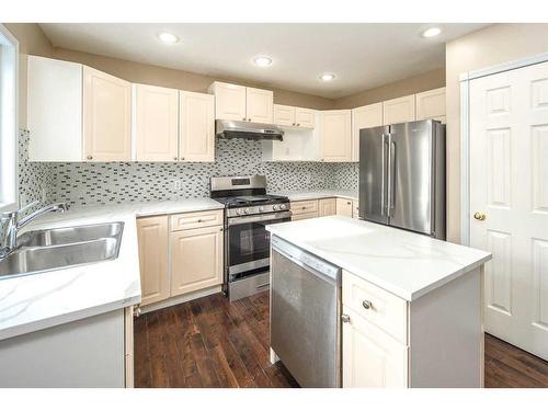 8 Arbour Ridge Place Nw, Calgary, AB - Indoor Photo Showing Kitchen With Double Sink With Upgraded Kitchen