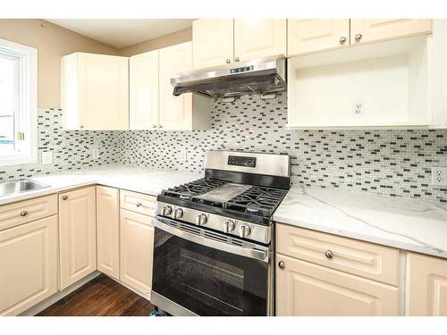 8 Arbour Ridge Place Nw, Calgary, AB - Indoor Photo Showing Kitchen With Upgraded Kitchen