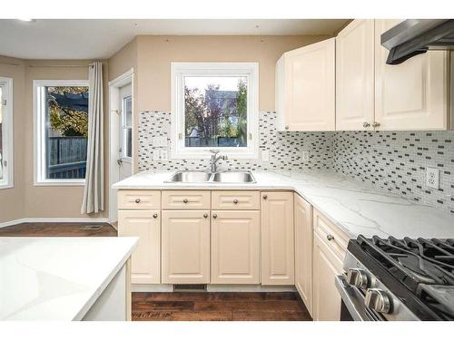 8 Arbour Ridge Place Nw, Calgary, AB - Indoor Photo Showing Kitchen With Double Sink