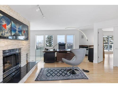 192 Blueridge Rise, Rural Rocky View County, AB - Indoor Photo Showing Other Room With Fireplace