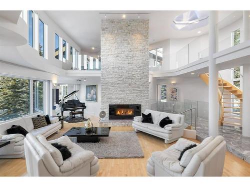 192 Blueridge Rise, Rural Rocky View County, AB - Indoor Photo Showing Living Room With Fireplace