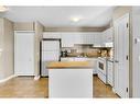 311-1715 35 Street Se, Calgary, AB  - Indoor Photo Showing Kitchen With Double Sink 