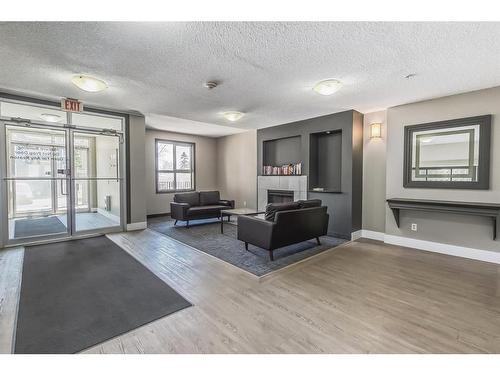 4306-73 Erin Woods Court Se, Calgary, AB - Indoor With Fireplace