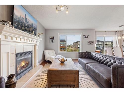 692 Luxstone Landing Sw, Airdrie, AB - Indoor Photo Showing Living Room With Fireplace