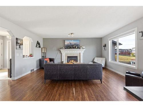 692 Luxstone Landing Sw, Airdrie, AB - Indoor Photo Showing Living Room With Fireplace