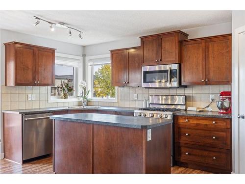 692 Luxstone Landing Sw, Airdrie, AB - Indoor Photo Showing Kitchen With Double Sink