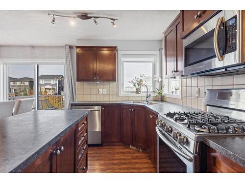 692 Luxstone Landing Sw, Airdrie, AB - Indoor Photo Showing Kitchen With Double Sink