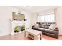 110 Taravista Drive Ne, Calgary, AB  - Indoor Photo Showing Living Room With Fireplace 