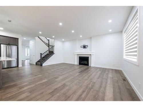 907 Corner Meadows Way Ne, Calgary, AB - Indoor Photo Showing Other Room With Fireplace