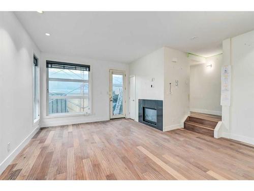 2-834 Mcpherson Road Ne, Calgary, AB - Indoor With Fireplace