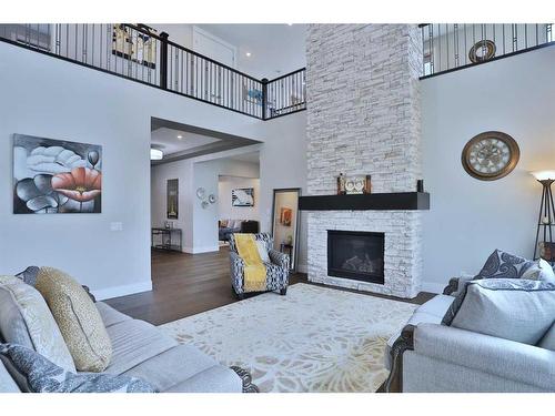 13 Damkar Drive, Rural Rocky View County, AB - Indoor Photo Showing Living Room With Fireplace