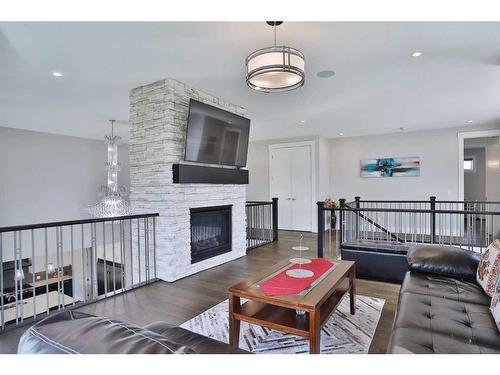 13 Damkar Drive, Rural Rocky View County, AB - Indoor Photo Showing Living Room With Fireplace