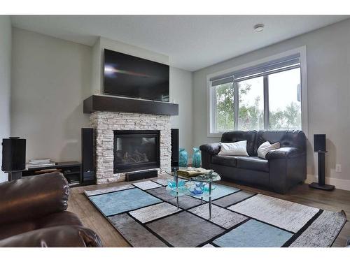 13 Damkar Drive, Rural Rocky View County, AB - Indoor Photo Showing Living Room With Fireplace