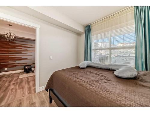 102-19661 40 Street Se, Calgary, AB - Indoor Photo Showing Bedroom