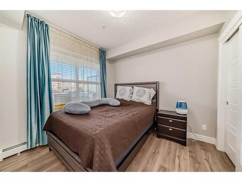 102-19661 40 Street Se, Calgary, AB - Indoor Photo Showing Bedroom