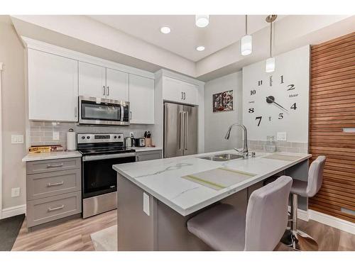 102-19661 40 Street Se, Calgary, AB - Indoor Photo Showing Kitchen With Upgraded Kitchen