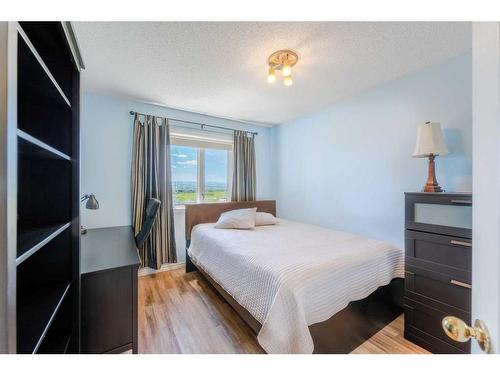 363 Rocky Ridge Drive Nw, Calgary, AB - Indoor Photo Showing Bedroom