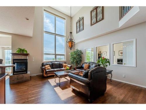 363 Rocky Ridge Drive Nw, Calgary, AB - Indoor Photo Showing Living Room With Fireplace