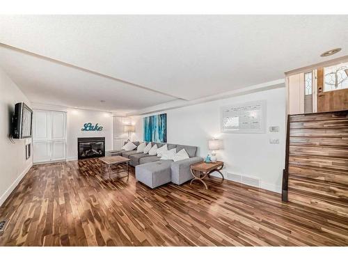 1069 East Chestermere Drive, Chestermere, AB - Indoor Photo Showing Living Room With Fireplace