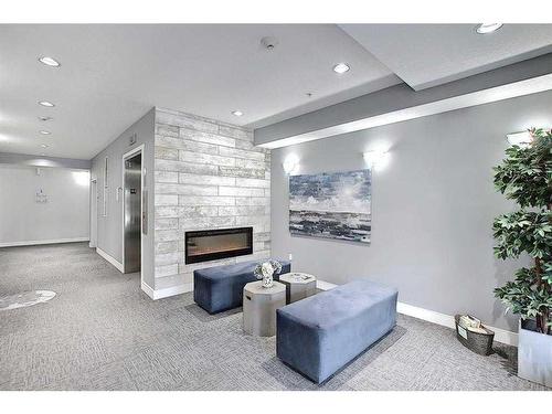 1215-3727 Sage Hill Drive Nw, Calgary, AB - Indoor With Fireplace