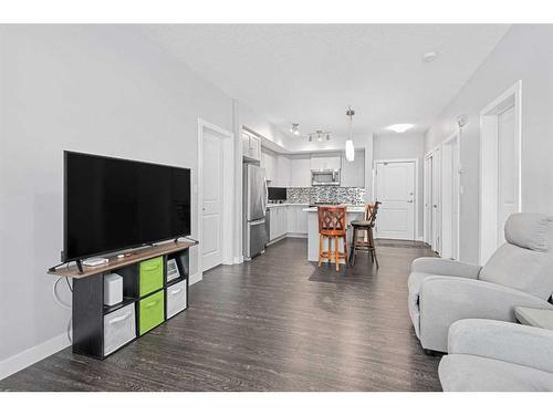 1215-3727 Sage Hill Drive Nw, Calgary, AB - Indoor Photo Showing Living Room