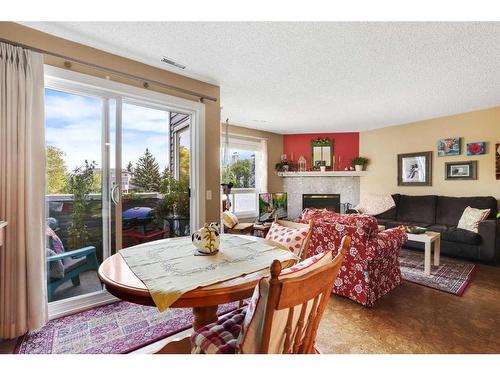 43-200 Shawnessy Drive Sw, Calgary, AB - Indoor With Fireplace