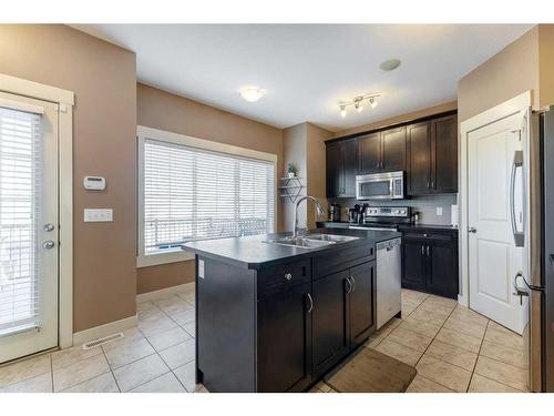 292 Rainbow Falls Drive, Chestermere, AB - Indoor Photo Showing Kitchen With Double Sink