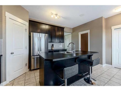 292 Rainbow Falls Drive, Chestermere, AB - Indoor Photo Showing Kitchen With Stainless Steel Kitchen With Double Sink