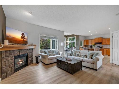 203 Evergreen Heights Sw, Calgary, AB - Indoor Photo Showing Living Room With Fireplace