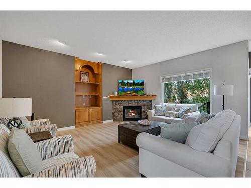 203 Evergreen Heights Sw, Calgary, AB - Indoor Photo Showing Living Room With Fireplace