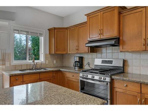 203 Evergreen Heights Sw, Calgary, AB - Indoor Photo Showing Kitchen With Double Sink