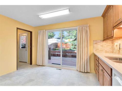 36 Silver Ridge Rise Nw, Calgary, AB - Indoor Photo Showing Kitchen With Double Sink