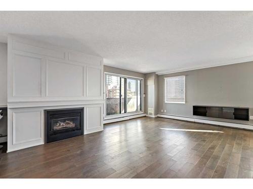 701-235 15 Avenue Sw, Calgary, AB - Indoor Photo Showing Living Room With Fireplace