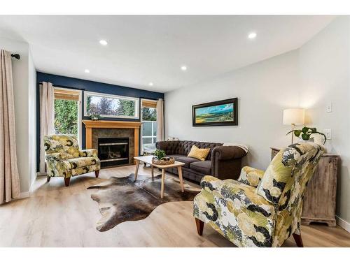 10 Tuscany Meadows Heights Nw, Calgary, AB - Indoor Photo Showing Living Room With Fireplace