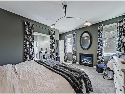 4502 20 Avenue Nw, Calgary, AB - Indoor Photo Showing Bedroom With Fireplace