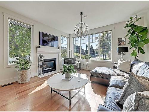 4502 20 Avenue Nw, Calgary, AB - Indoor Photo Showing Living Room With Fireplace