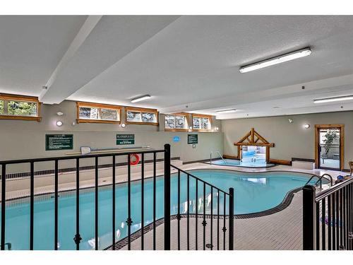 204-155 Crossbow Place, Canmore, AB - Indoor Photo Showing Other Room With In Ground Pool