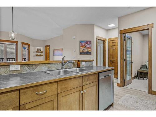 204-155 Crossbow Place, Canmore, AB - Indoor Photo Showing Kitchen With Double Sink